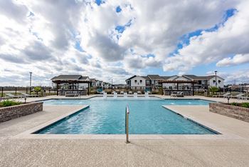 Resort-style swimming pool with tanning ledge